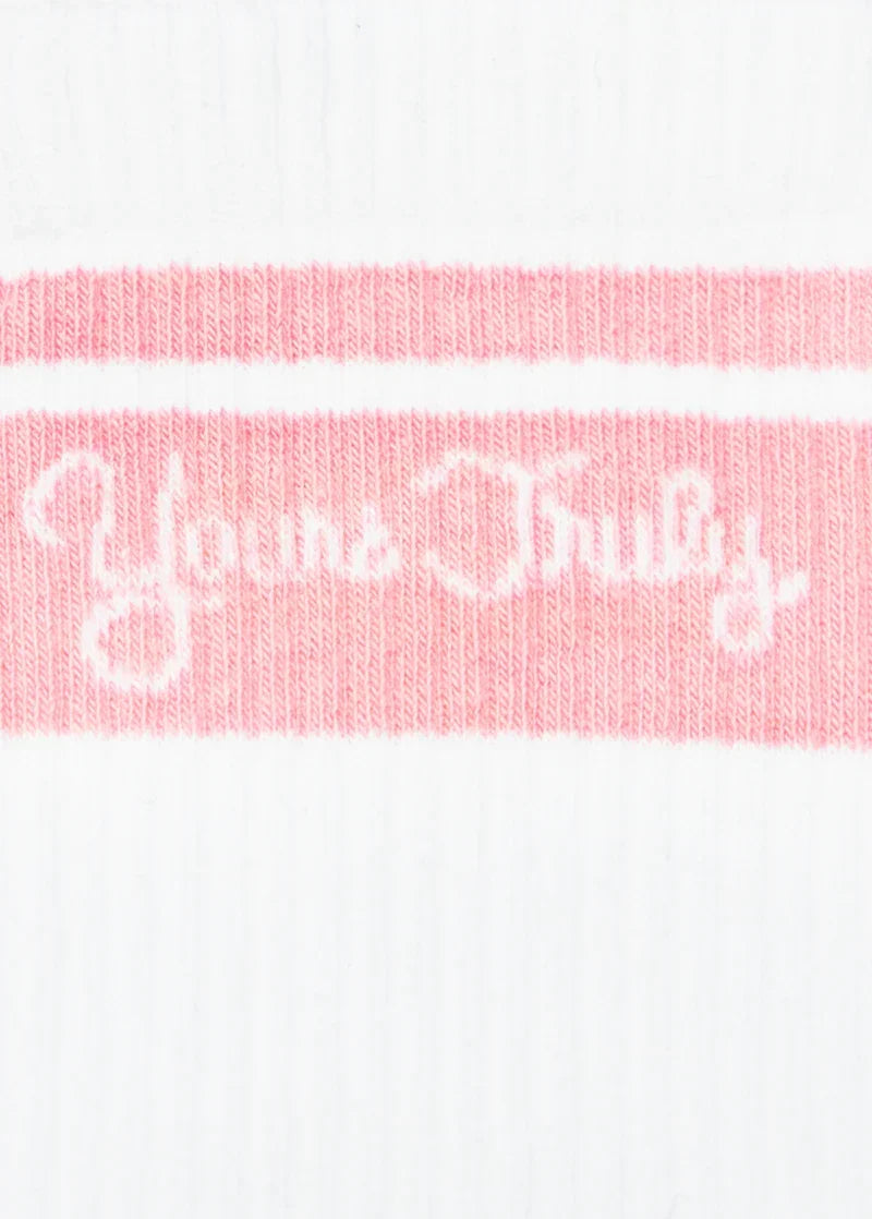 Close-up of pink Yours Truly logo knit detail on white Ariana Grande anniversary crew socks