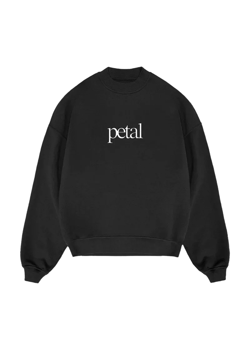 Ariana Grande Petal black crewneck sweatshirt with minimalist white logo graphic and oversized fit front