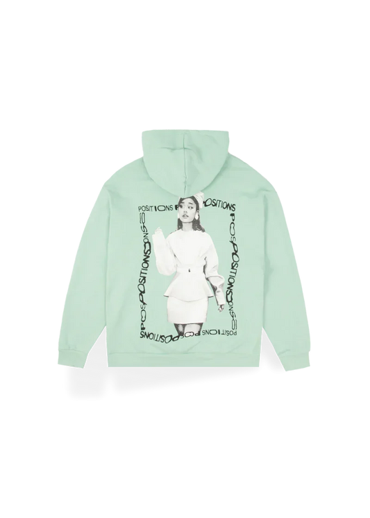 Mint green Ariana Grande Positions hoodie back view with monochrome portrait artwork and circular logo design