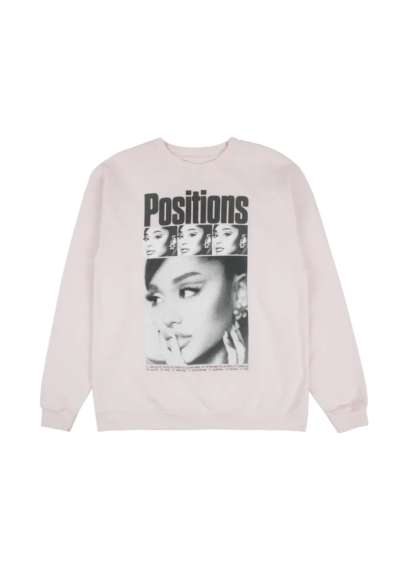 Light pink Ariana Grande Positions crewneck front view with retro collage portrait graphic and album tracklist