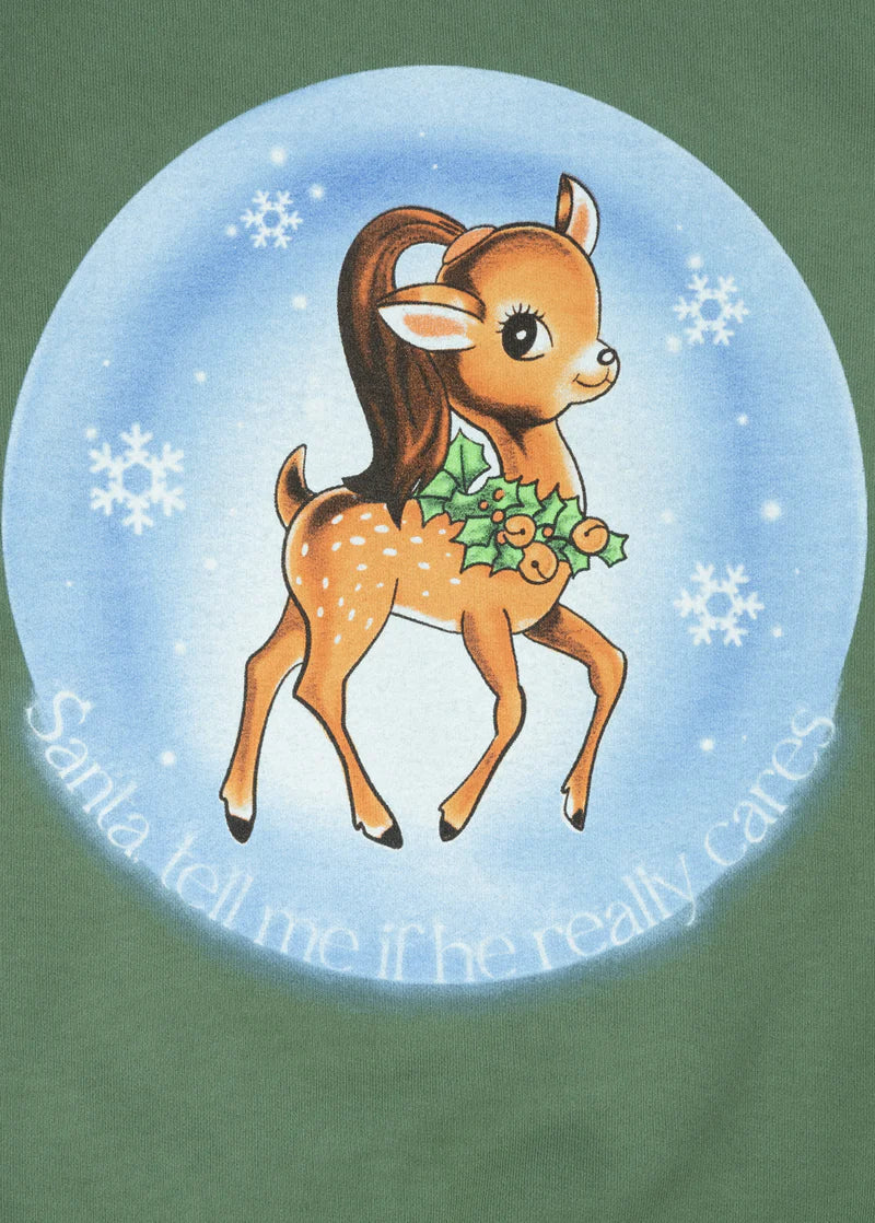 Close-up detail of Ariana Grande Santa Tell Me crewneck featuring retro deer artwork and snowflake holiday design