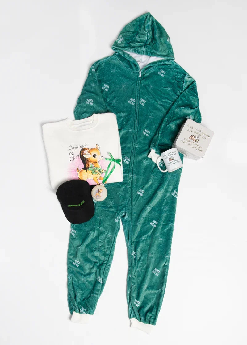 Ariana Grande Santa Tell Me holiday merch set featuring green fleece onesie and festive winter accessories