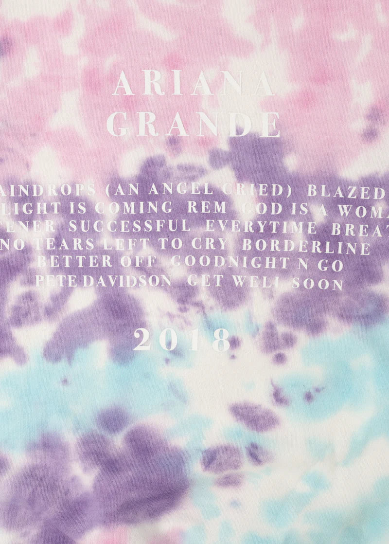 Close-up detail of Ariana Grande Sweetener era tie-dye crewneck with white album tracklist typography graphic