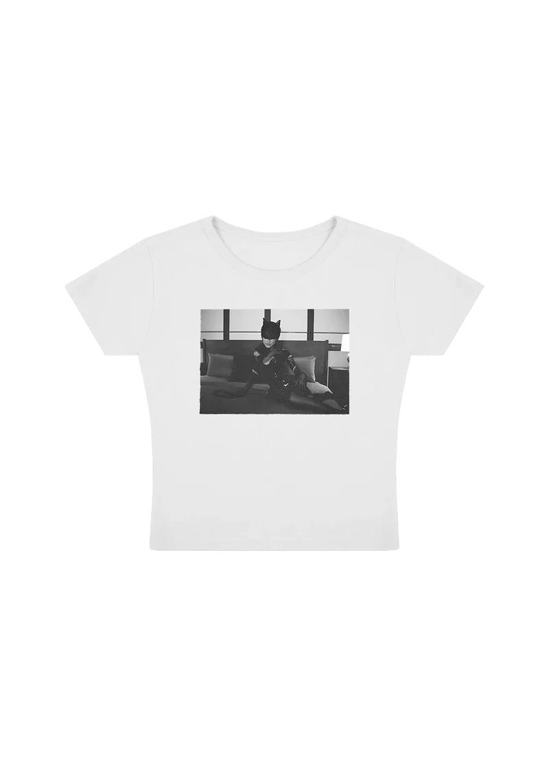 White Ariana Grande TBIM photo baby tee featuring black and white catwoman-inspired graphic with fitted soft cotton style