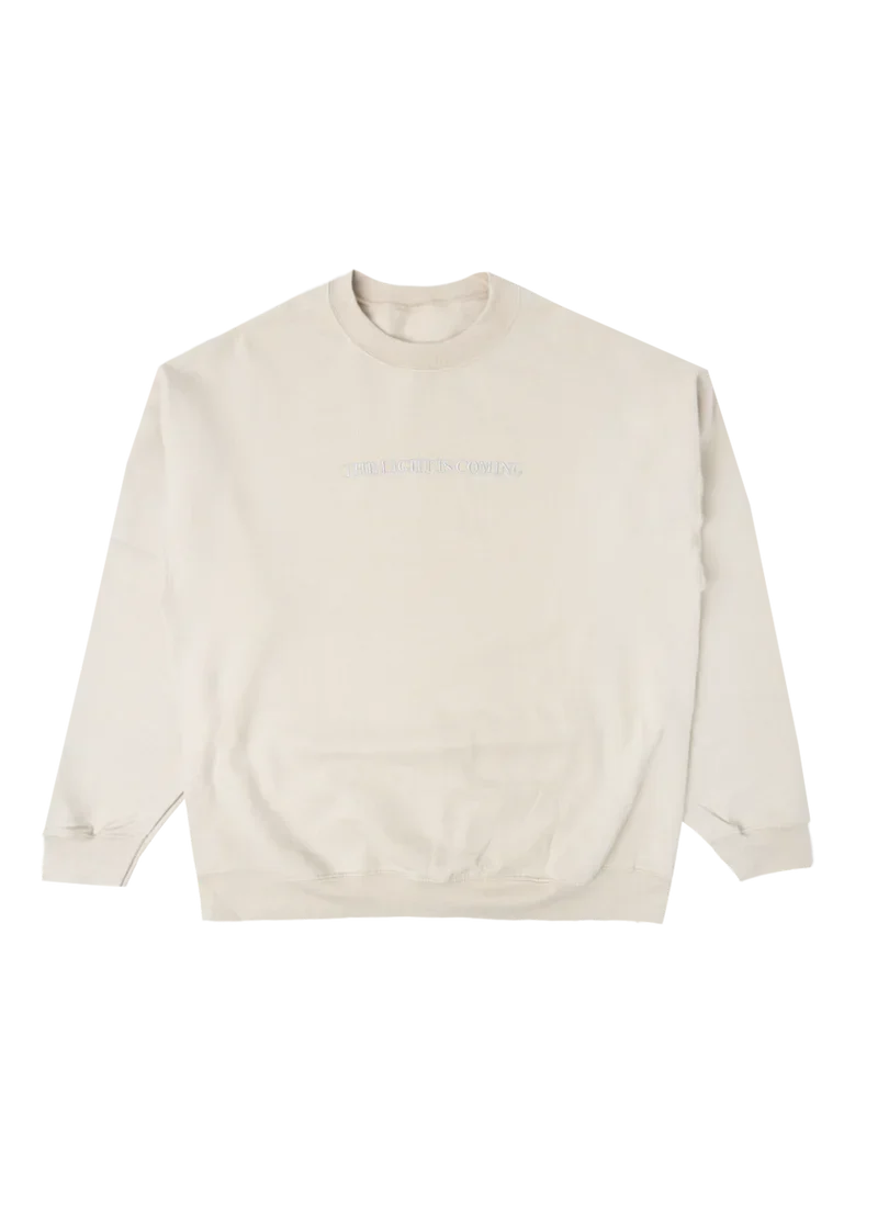 Cream Ariana Grande The Light Is Coming crewneck with minimalist embroidered text and oversized cozy sweatshirt fit