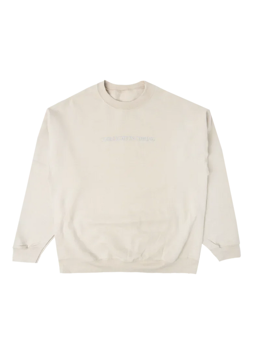Cream Ariana Grande The Light Is Coming crewneck with minimalist embroidered text and oversized cozy sweatshirt fit