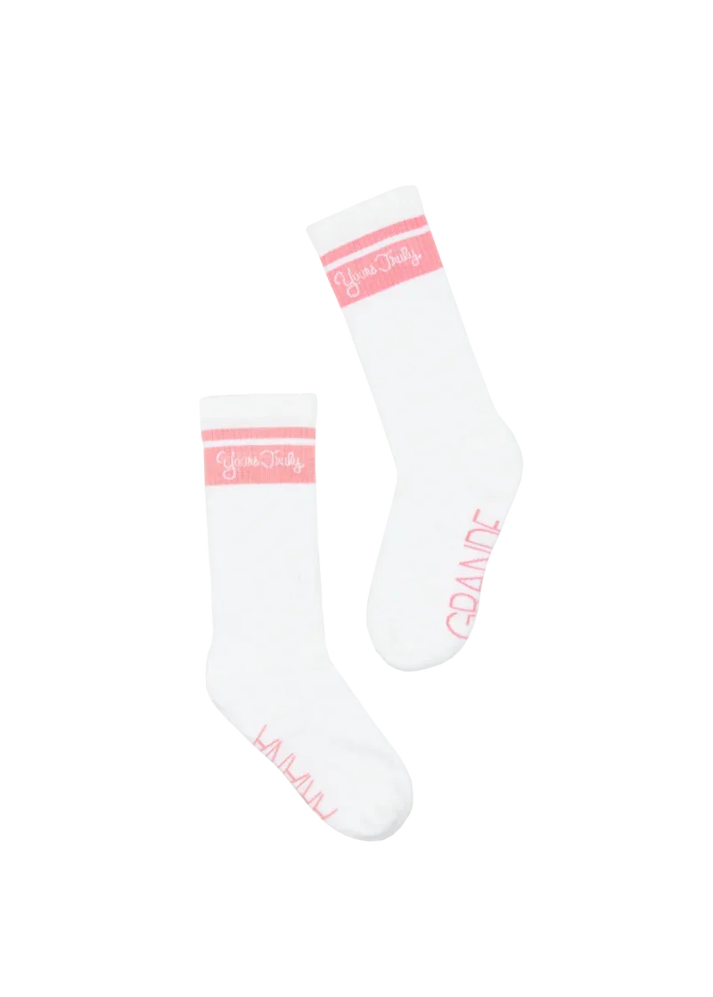 White Ariana Grande Yours Truly 10th anniversary socks with pink stripe detailing and soft retro-inspired knit design