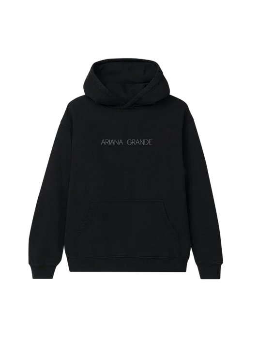 Black Ariana Grande Yours Truly hoodie front view with minimalist logo embroidery and oversized fit