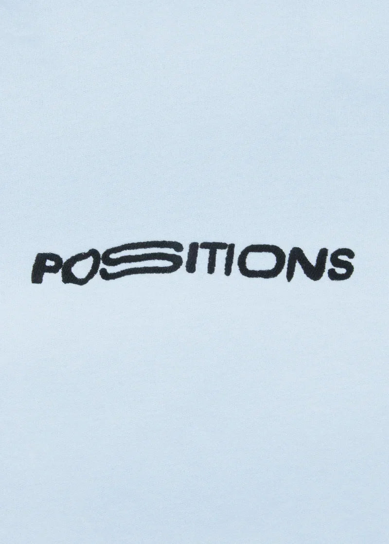 Light blue Positions crewneck with black embroidered Positions logo graphic detail