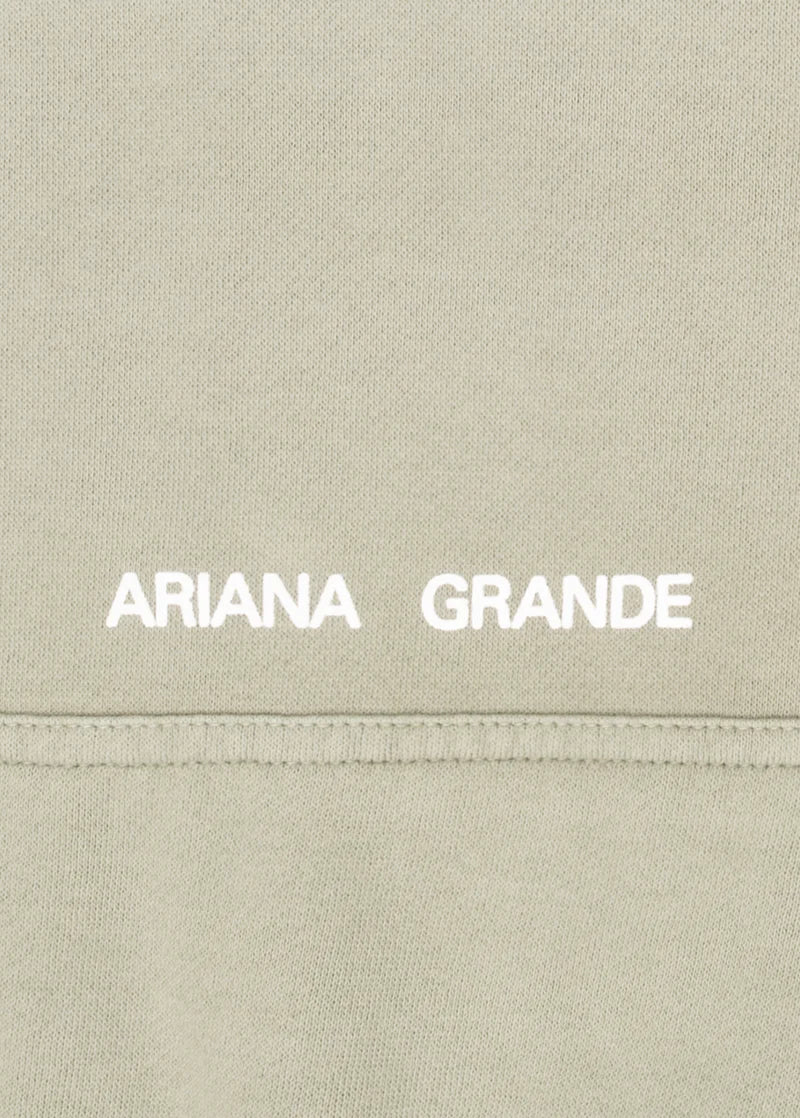 Beige Positions hoodie with white Ariana Grande logo print above kangaroo pocket detail
