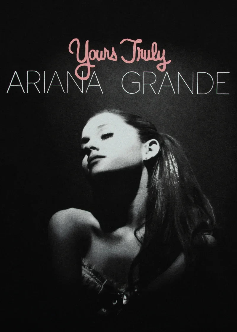 Close-up Ariana Grande Yours Truly puff print graphic on black anniversary merch t-shirt