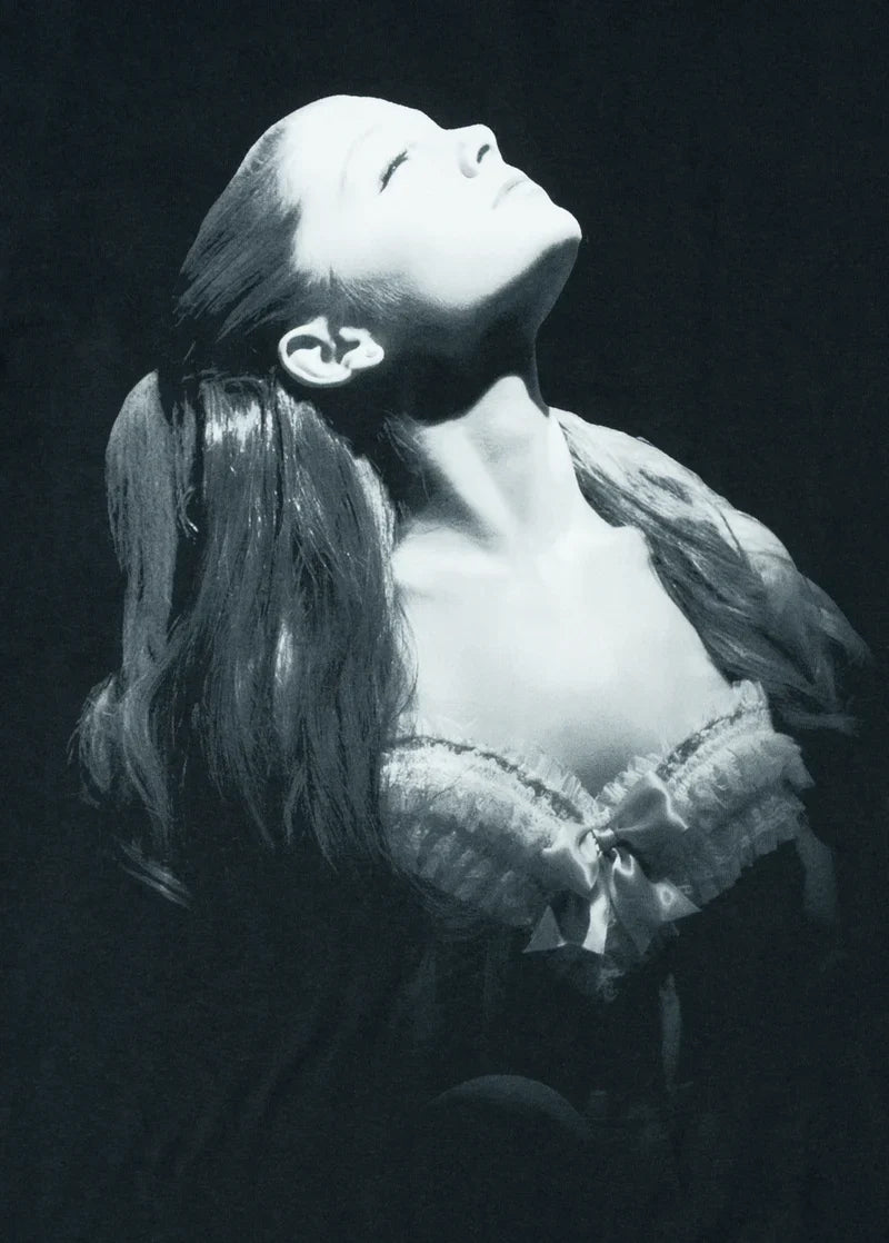 Close-up monochrome Ariana Grande portrait graphic on black Yours Truly merch t-shirt